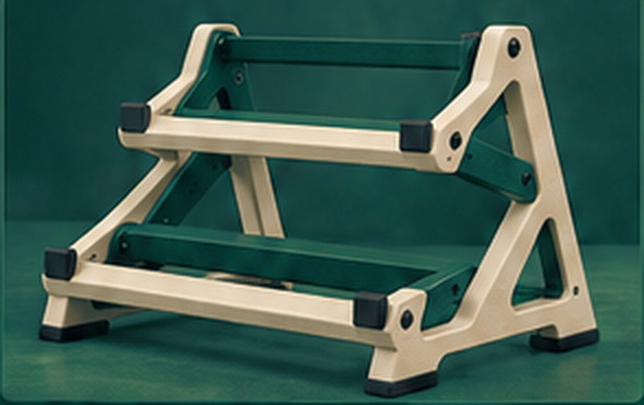 An ivory two-tier stand photographed against a deep green backdrop